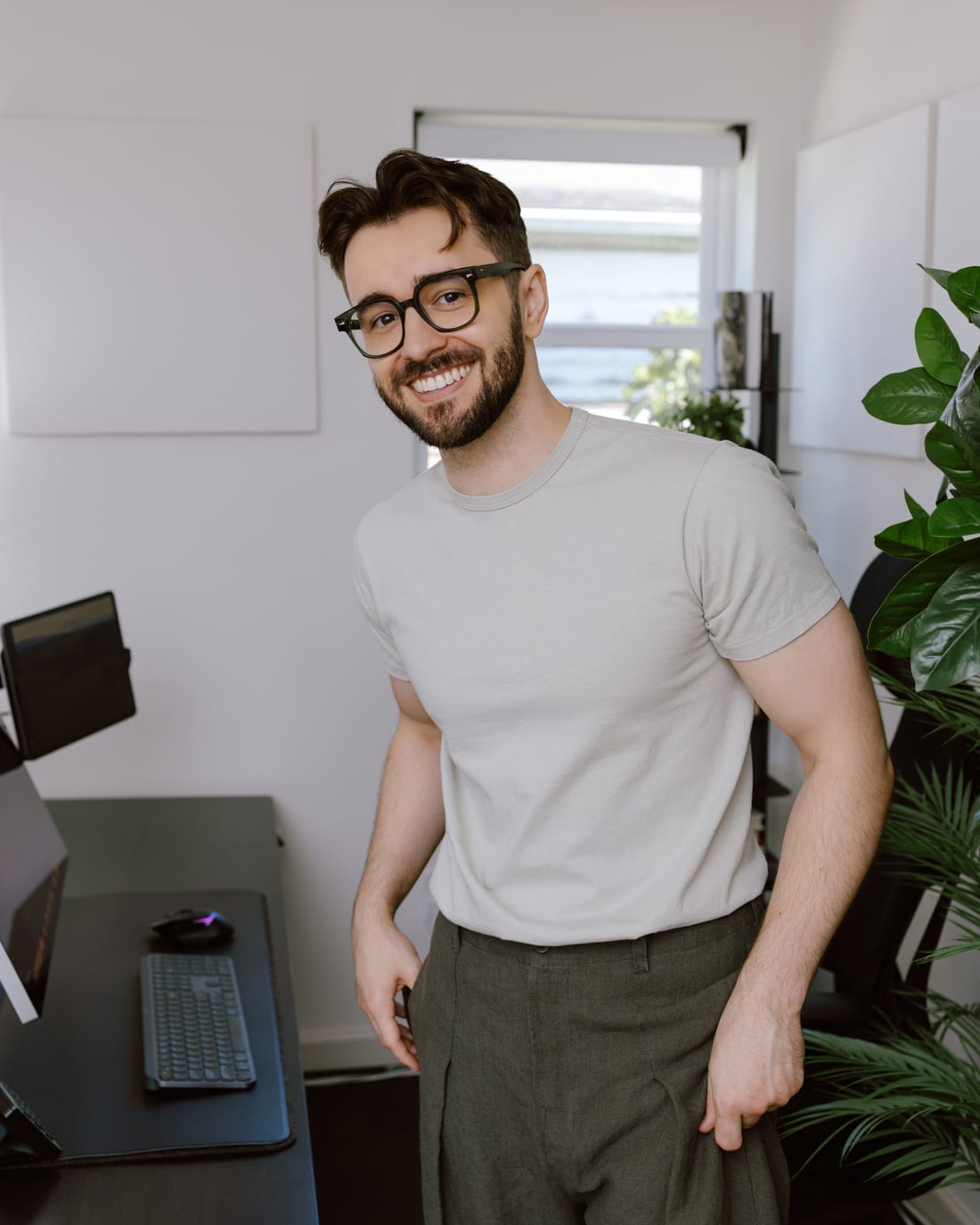Devlin Peck standing at his workstation